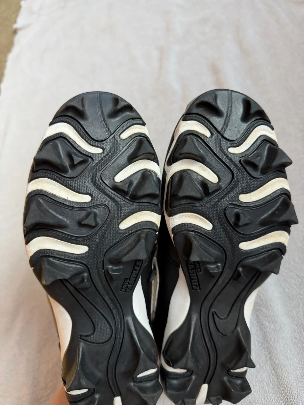 Nike Kids Black and White Baseball Cleats with Swoosh